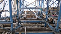 Photo 11. Adjustment of the position of horizontal metal beams of the metal frame