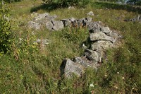 Каменная кладка подковообразной формы на острове Радколье