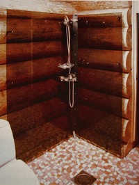 New solution and old tradition. In shower corner chilled glass panel protecting log wall (ill 7)
