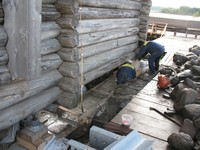 Fig.33. Pouring of the foundation below lifted Church framework